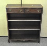 A set of mahogany bookshelves comprising two small drawers over three shelves,