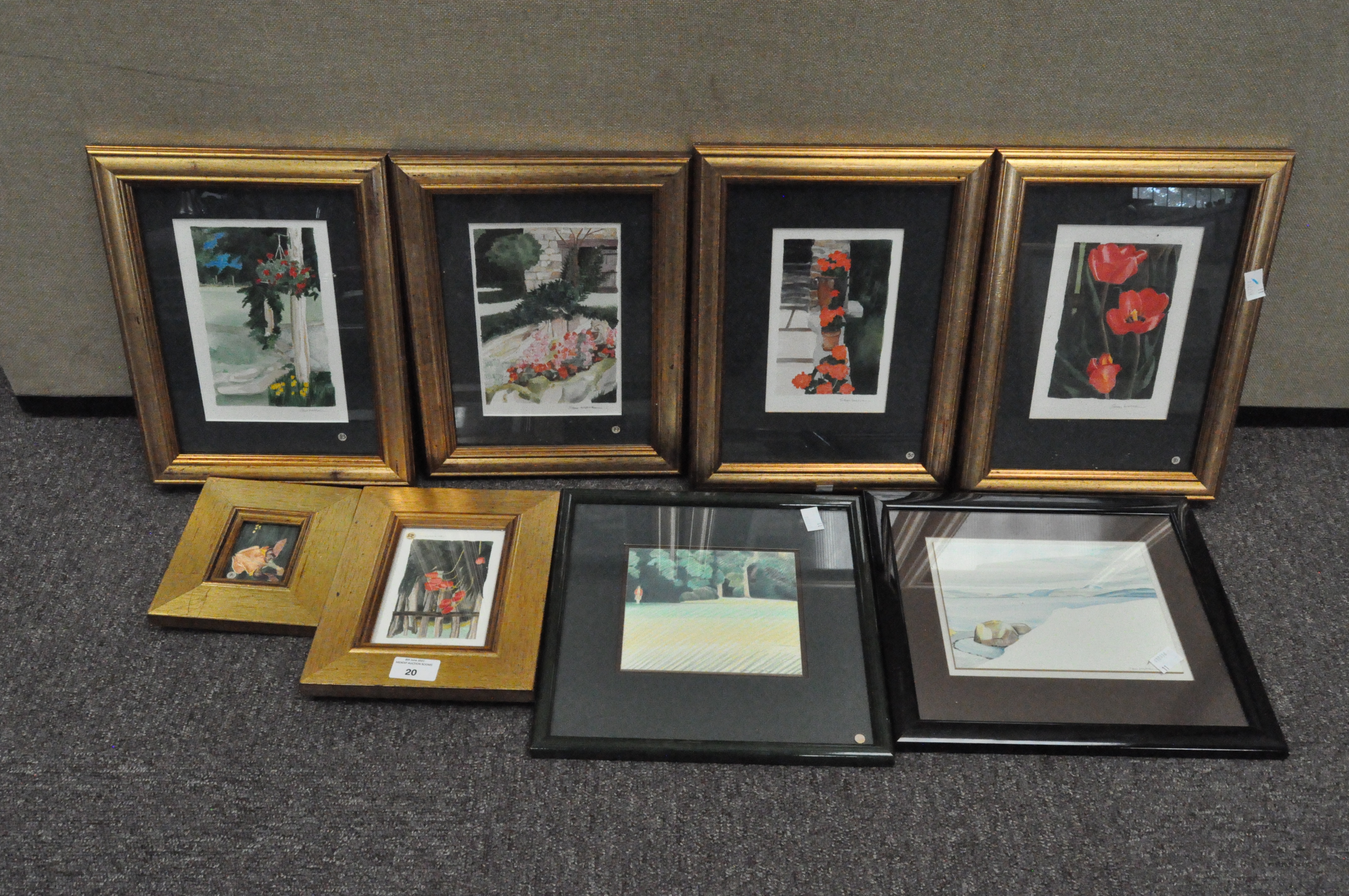A collection of framed pictures, including numerous floral watercolours,