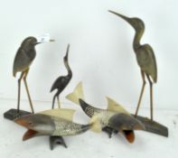 A group of carved horn birds and fish, comprising three Heron/Cranes and two fish,