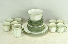 An E H & Co "Carnation" pattern six piece tea set, comprising cups, saucers,