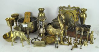 Assorted brassware, to include an ornate pair of picture frames, model depicting a coal miner,