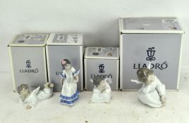 A group of four Lladro porcelain figures, three of Angels, all boxed,