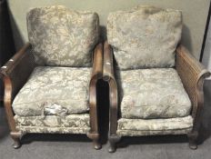 A pair of bergere chairs, late 19th/early century, each with drop-in cushions,