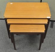 A mid century nest of three coffee tables,