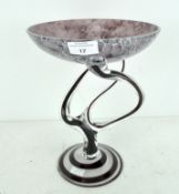 An ornate stylized glass tazza, possibly Canadian, with swirl pattern to stem,