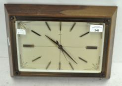 A vintage Metamec wall clock, of rectangular form, the dial with batons denoting hours,