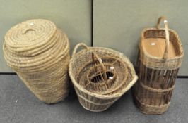 A group of four wicker baskets, including a large lidded laundry basket,