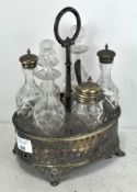 A silver plated six piece cruet set stand with six glass bottles,