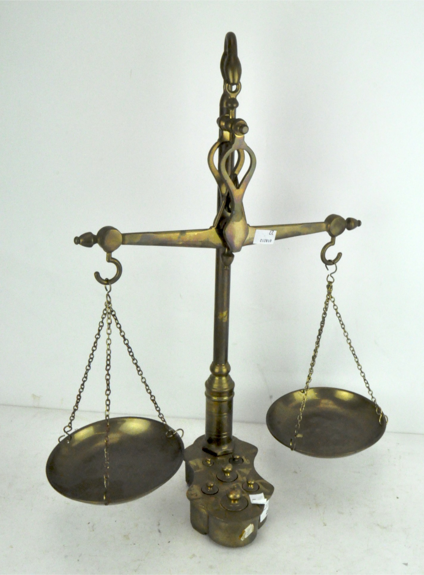 A set of early 20th century brass scales with weights,