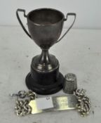 A small silver trophy,