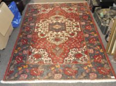 A 20th century rug with floral decoration,