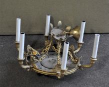 A brass six-light chandelier, in the French Regency style,