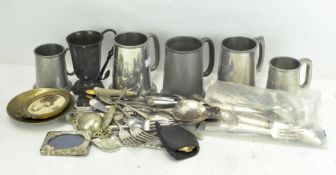 A group of pewter tankards and silver plate wares,