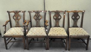 An oak set of eight dining chairs, with upholstered seats,