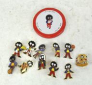 A group of eleven vintage Robertson's enamel Golly pin badges