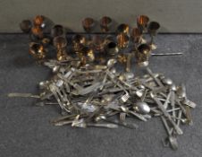 A collection of Thai bronzed flatware, serving spoons,