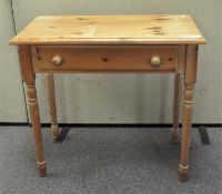 A scrubbed pine side table with one fitted drawer,