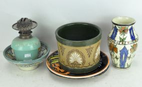 A selection of various ceramics, including decorative chargers and vases,
