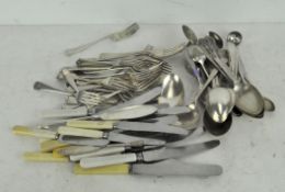 A collection of vintage stainless steel flatware,