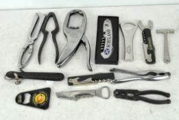 A selection of bottle openers and corkscrews,