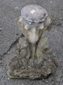 A reconstituted stone figure garden stand,
