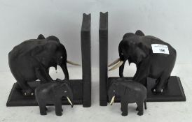 A pair of ebony inlaid book ends in the form of elephants, 18cm high,