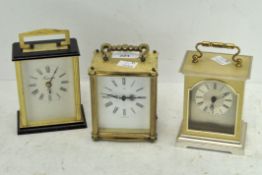 Three modern carriage clocks, each with Quartz movements,