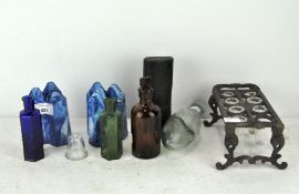 A collection of glass bottles and other glassware,