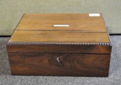 A late 19th century mahogany jewellery box of rectangular form with inlaid mother of pearl