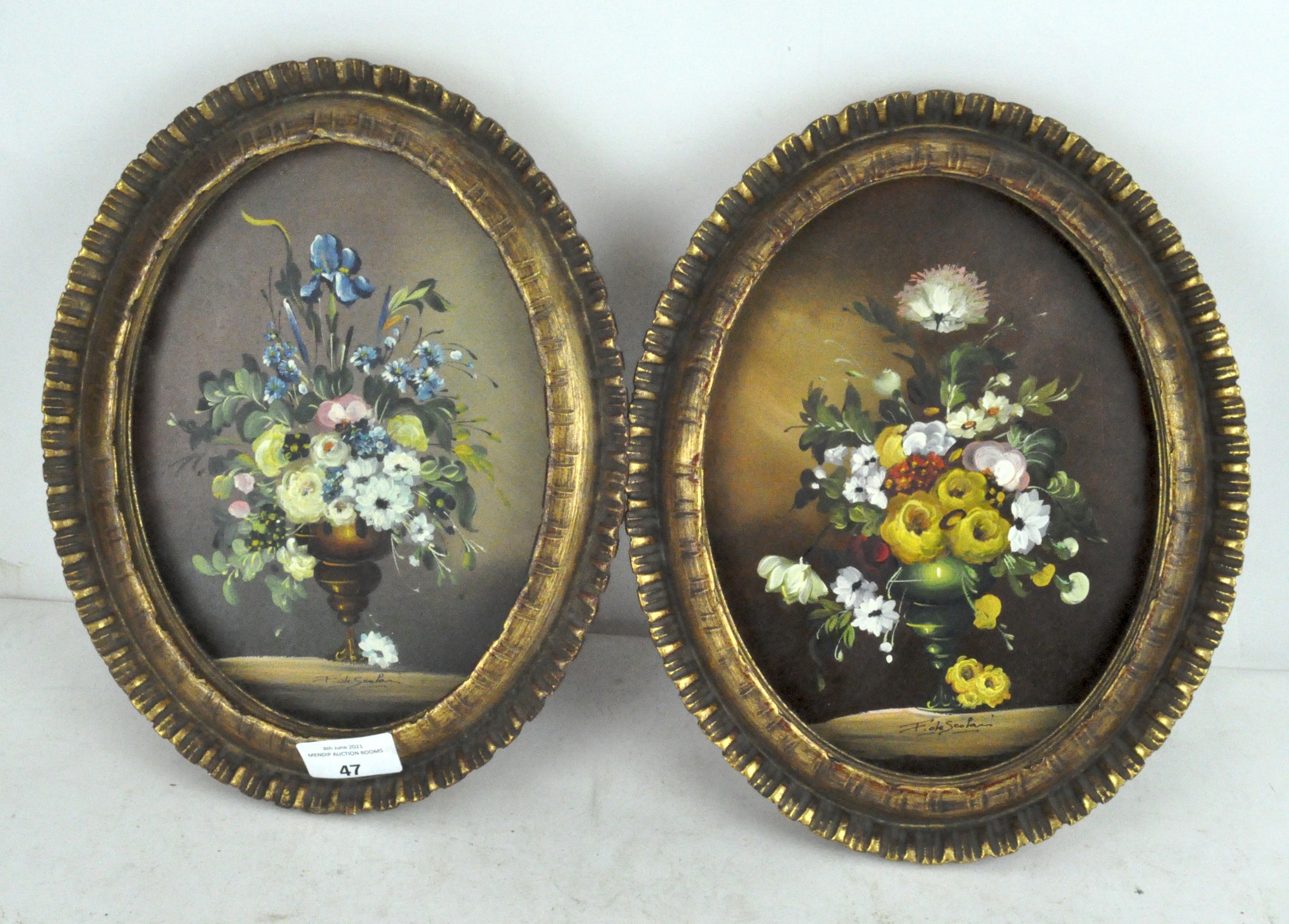 A pair of Continental pictures depicting floral bouquets,