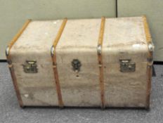 A vintage wooden bound storage travelling trunk,