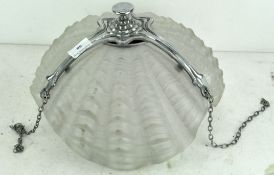 A vintage chrome and glass ceiling light in the form of a shell, in three sections,