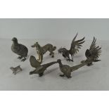 A collection of various silver plated and white metal animals, to include four pheasants,