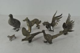 A collection of various silver plated and white metal animals, to include four pheasants,