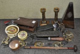A group of mixed collectables including a metronome, brass candle sticks,
