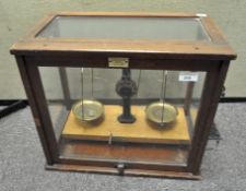 A set of 20th century balance scales, in original glazed case, by Philip Harris Ltd,