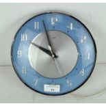 A vintage Metamec wall clock, light blue in colour,