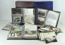 A collection of assorted postcard albums,