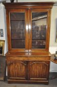 A Victorian mahogany bookcase, with a pair of glazed doors above a pair of panelled doors,