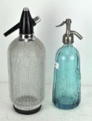 Two vintage soda syphons, including an early French example with blue glass body, dated 1935,