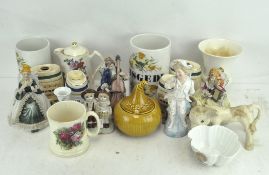 A collection of assorted ceramics, to include figures, Wade Barrells,