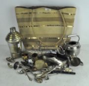 A group of silver plated wares, including an Art Deco cocktail shaker, assorted flatware,