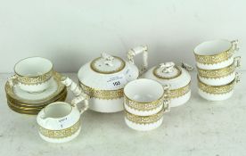A Victorian teaset, gilt on a white ground, by EJD Bodley, aesthetic movement in style,