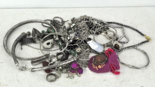 A collection of assorted silver and white metal jewellery, including chains, necklaces and a bangle,