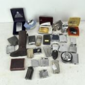 A large assortment of vintage lighters,