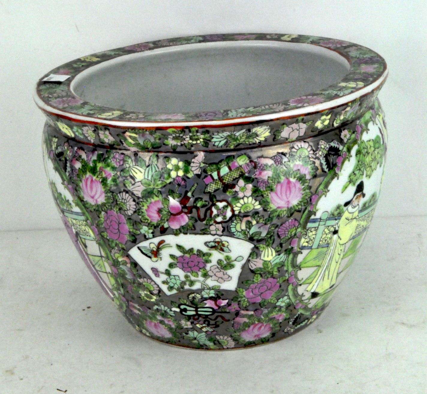 An Oriental glazed ceramic Famille Rose jardiniere,
