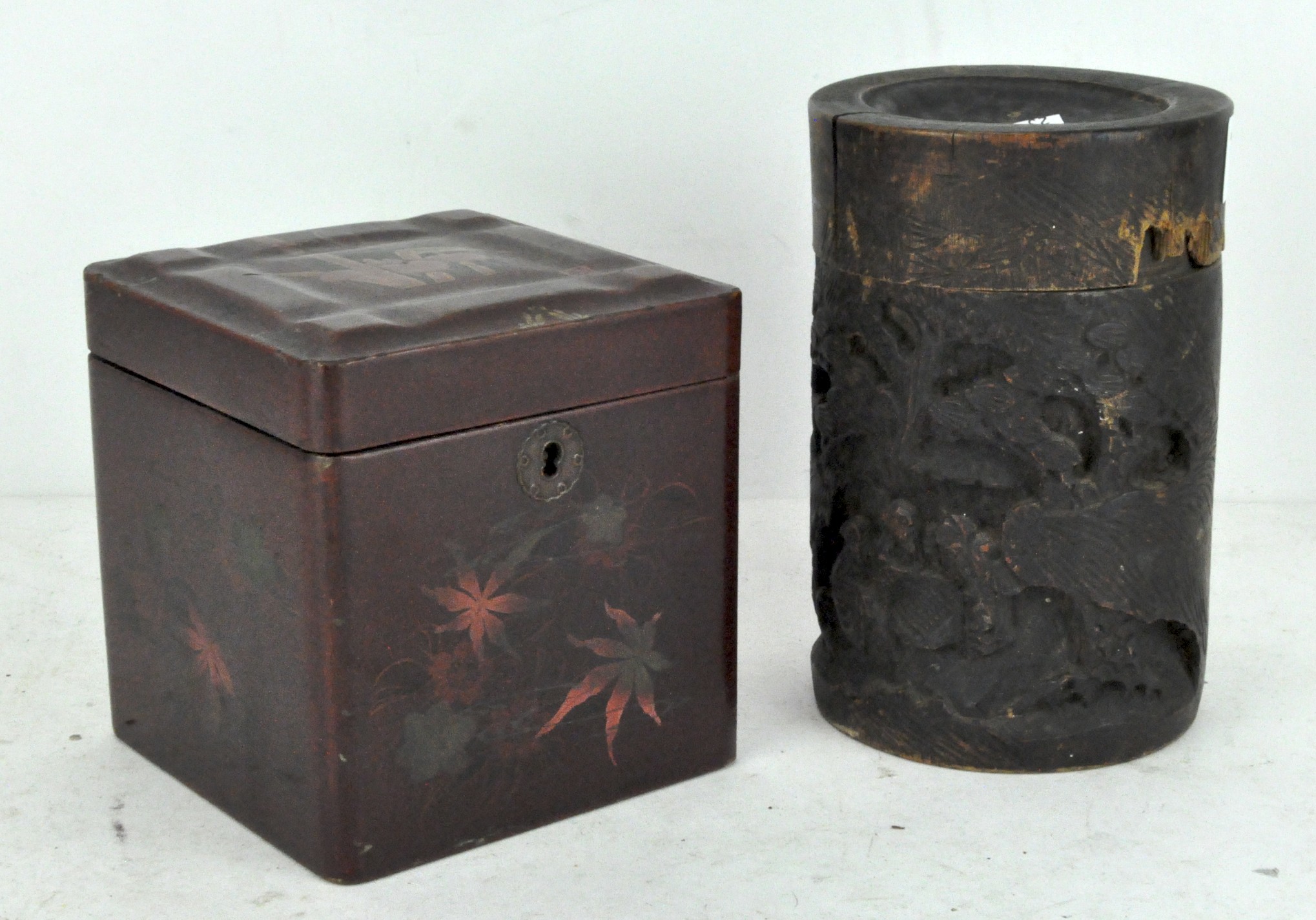An Oriental bamboo lidded pot, with carved scene to front,