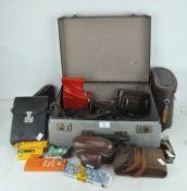 A collection of vintage cameras and equipment, including Kodak,