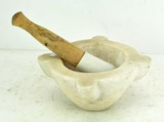 A large stone pestle and mortar,