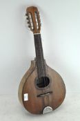 A vintage stringed instrument, possibly a lute, dated 1997, with inlaid decoration,